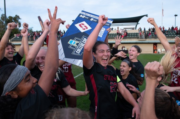 Women's soccer team celebrates after the game.